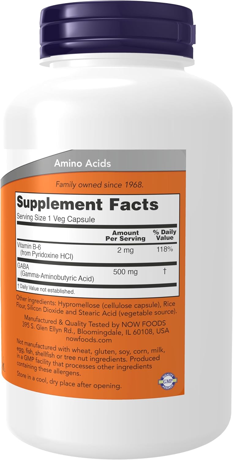 Frasco de NOW GABA 500 mg com informação nutricional, vitamina B6, rótulo laranja, tampa roxa e 200 cápsulas vegetais.
