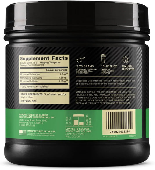 Pote preto de suplemento BCAA 5000 com rótulo verde, informações nutricionais e instruções de uso, fabricado nos EUA