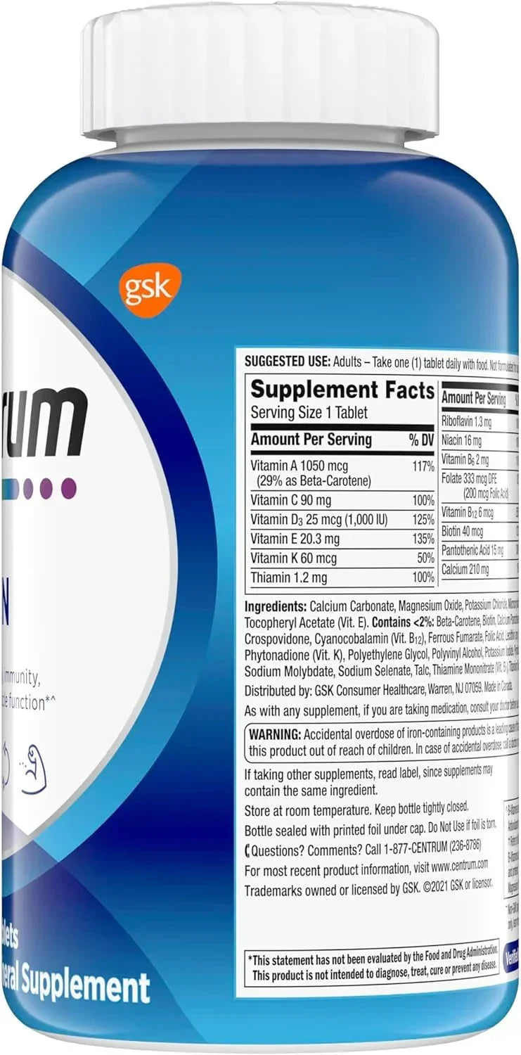 Suplemento Centrum com vitaminas A, C, D, E, K e minerais, frasco azul com rótulo detalhado de ingredientes e dosagem